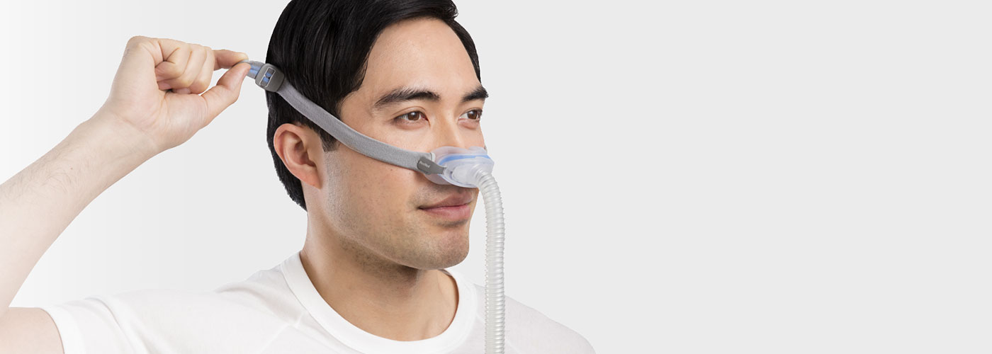 Sleep-apnoea-patient-adjusting-AirFit-N30-nasal-cradle-mask - ResMed UK